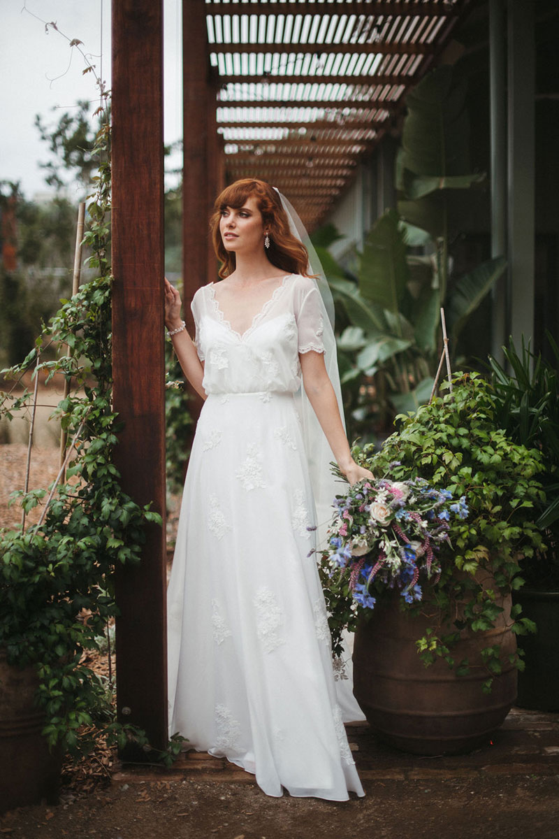Bride wearing flowing Magnolia gown, from French by Wendy Makin.