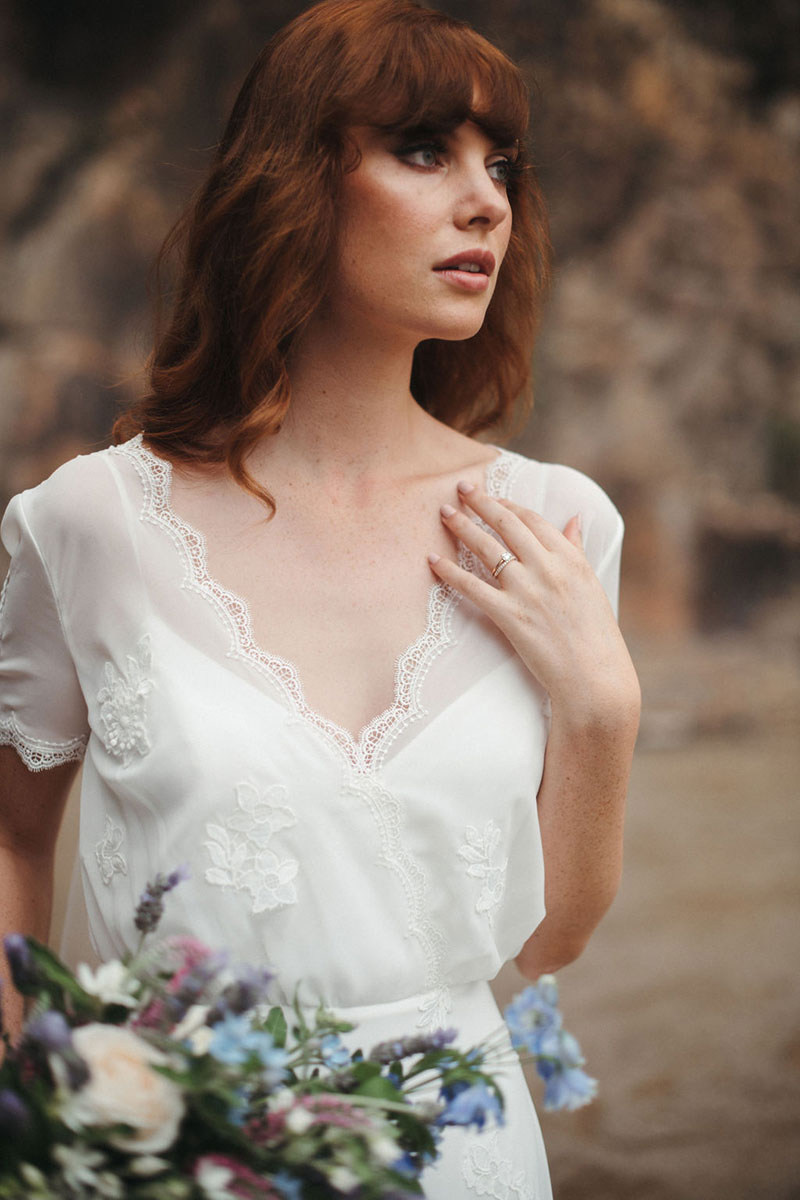 Bride wearing a delicate lace gown, Magnolia from French by Wendy Makin.