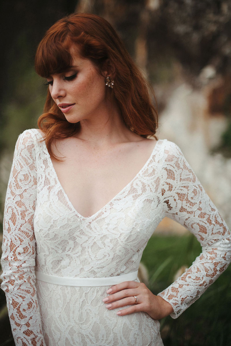 Close up of an allover lace wedding dress.