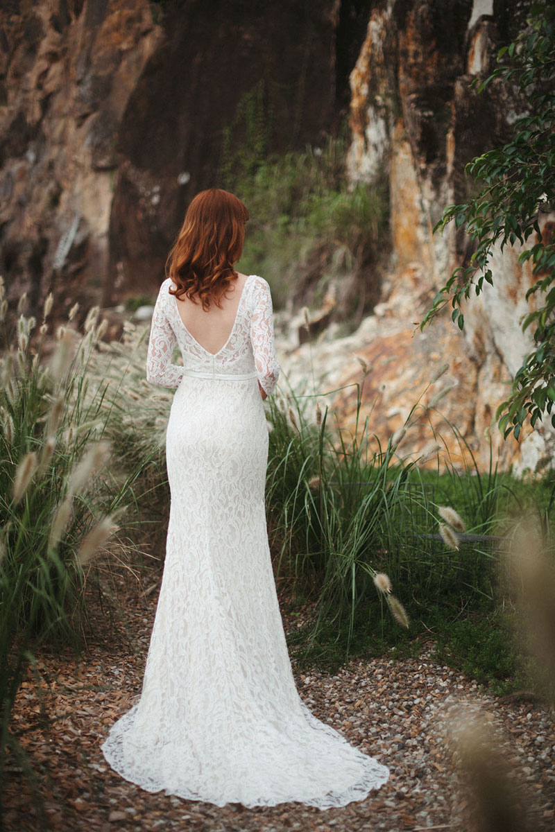 Back view of an allover lace gown.
