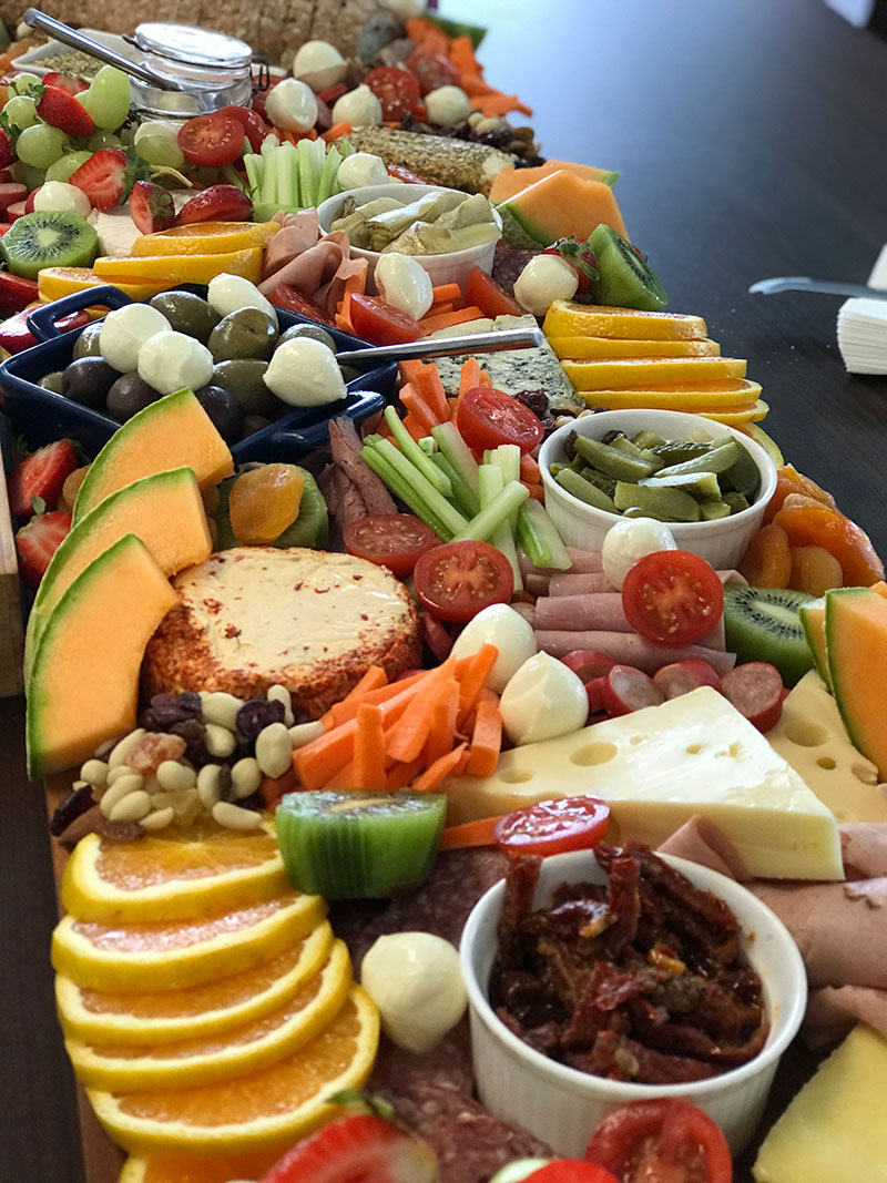 Large grazing board set up with lots of colourful finger food.