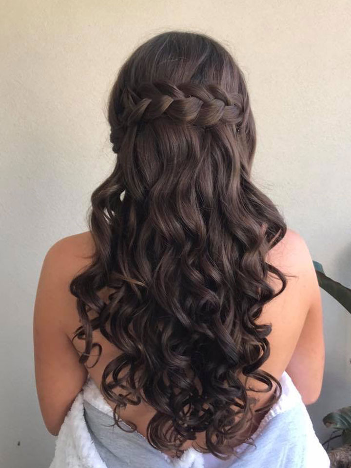 Long dark haired bride-to-be with romantic curls and braid