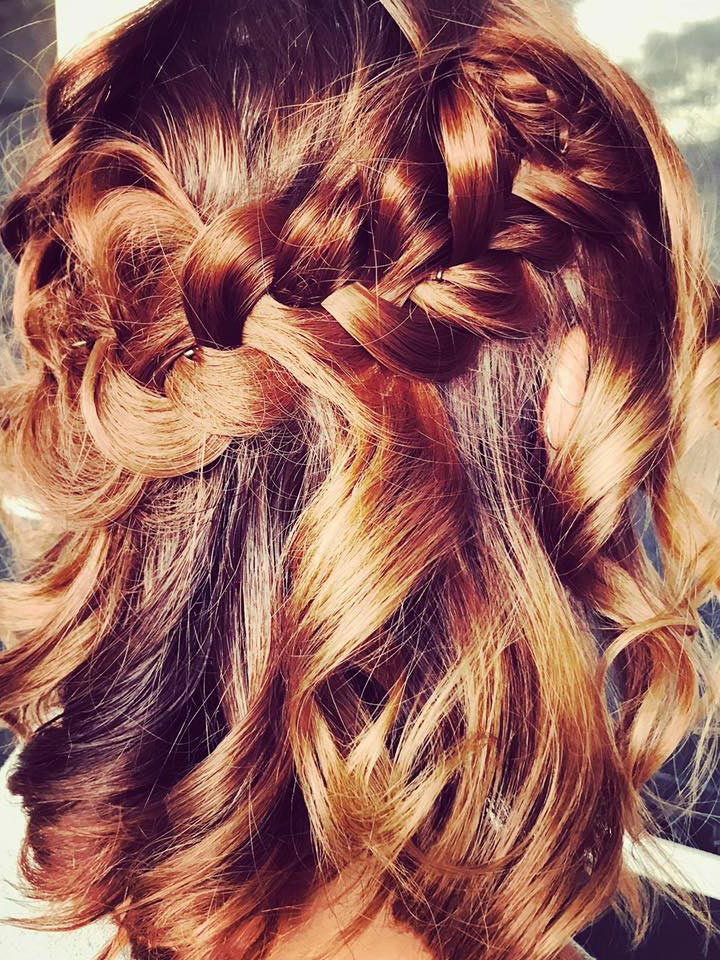 light coloured hair which has been curled and braided on a bride-to-be.