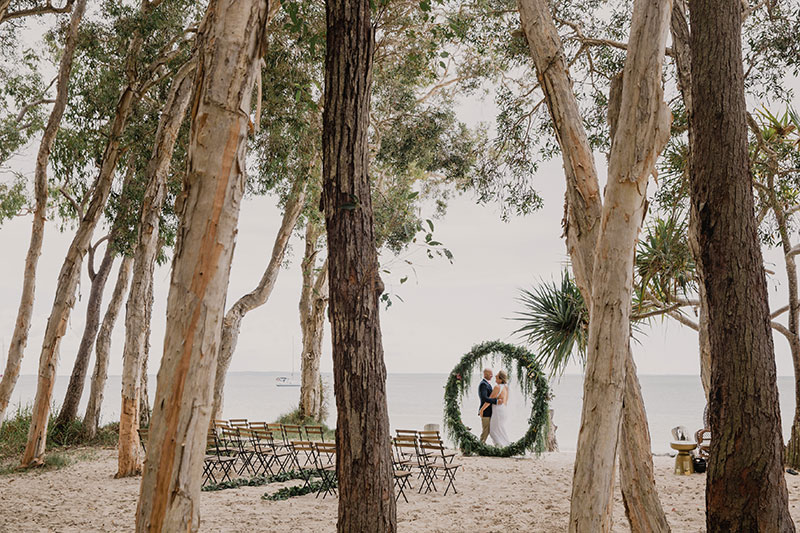 Getting married on the beach at Kingfisher Bay Resort.