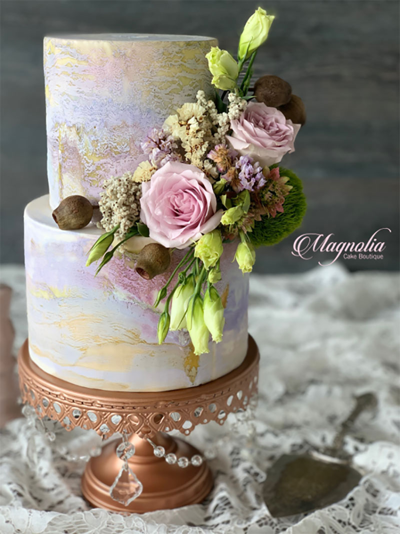 Marbled effect wedding cake with florals.