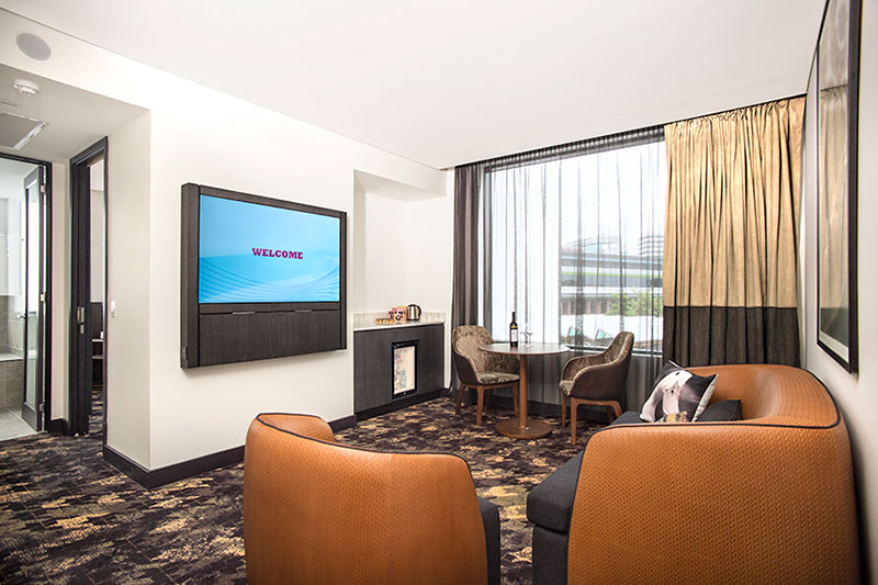 Lounge area of an Executive King Suite at Rydges Fortitude Valley.