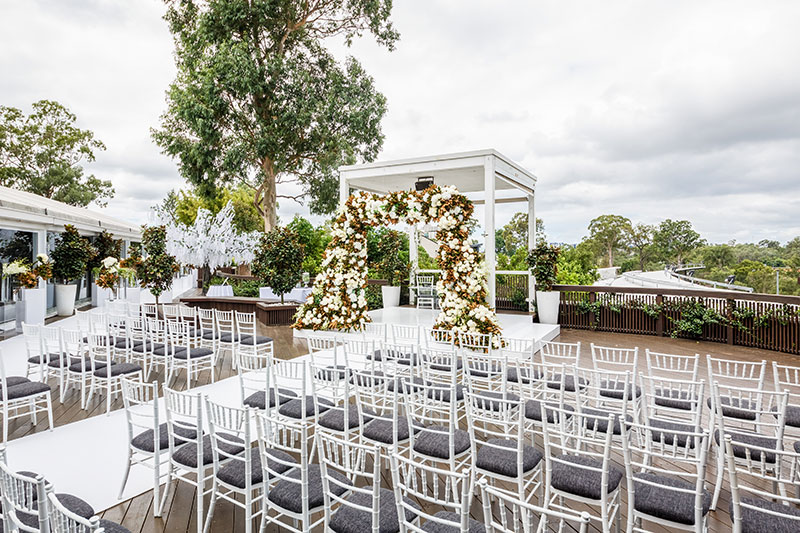 Wedding Ceremony set with Tiffany chairs on deck.