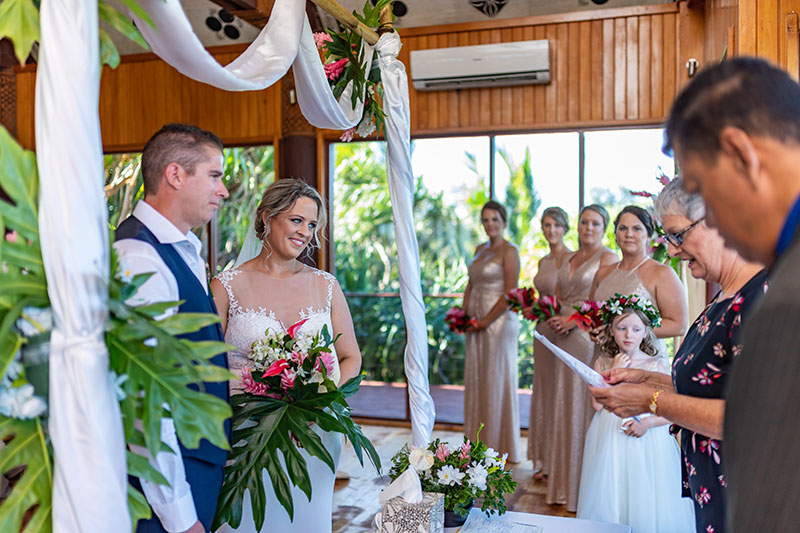 Happy bride and groom getting married in ceremony in Fiji.