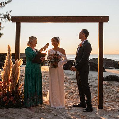 The Currumbin Celebrant officiating a wedding on the beach.
